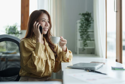 Young businesswoman working at office