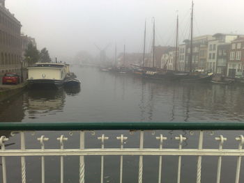 Sailboats in river during rainy season