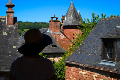 Rear view of woman looking at historic buildings