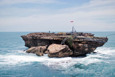 Scenic view of island against sky