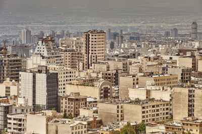 High angle view of city buildings against sky