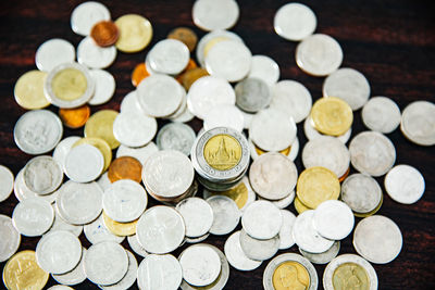 High angle view of coins on table