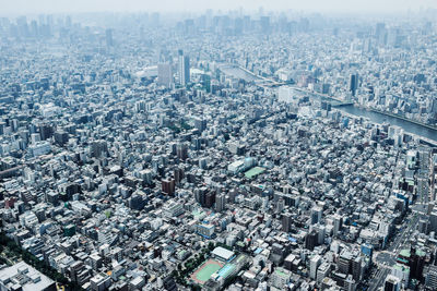 High angle view of modern city buildings against sky