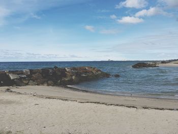 Scenic view of beach against sky