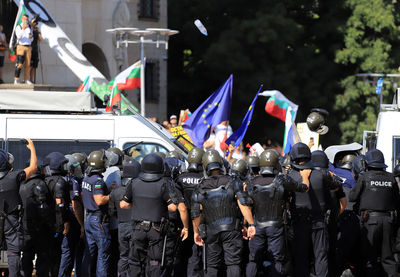 Police force controlling protestors on street