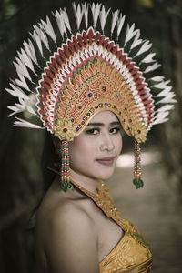 Close-up portrait of young woman wearing traditional clothing