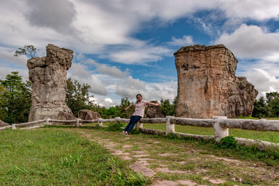 Man standing at park against sky