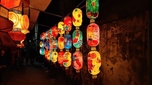 Illuminated lanterns hanging at night