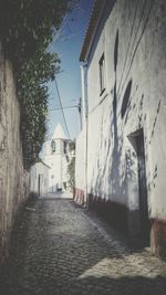 Houses in town against sky