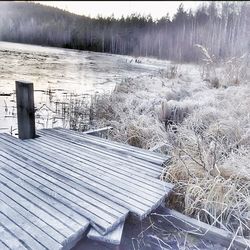 Snow covered wooden fence