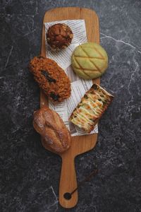 High angle view of bread on cutting board