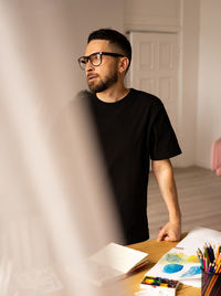 Portrait of young man working at home