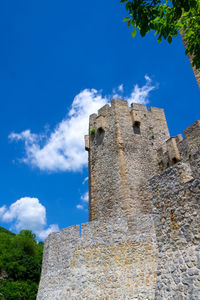 Low angle view of old building against sky