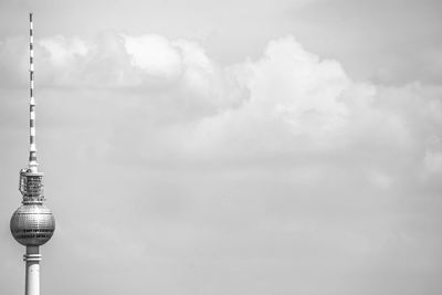 Low angle view of communications tower against sky