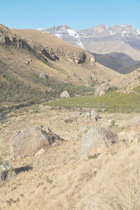 Scenic view of landscape and mountains against sky