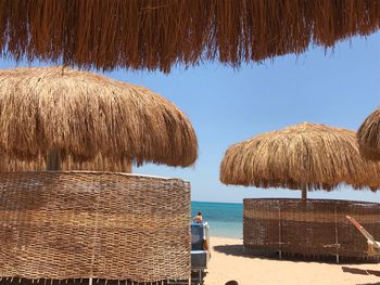 Panoramic view of beach against clear sky