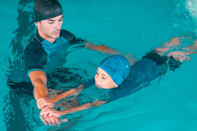 High angle view of man swimming in pool