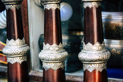 Close-up of religious bowls in temple