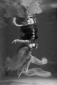 Woman swimming in sea