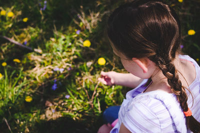 Close-up of girl holding plants