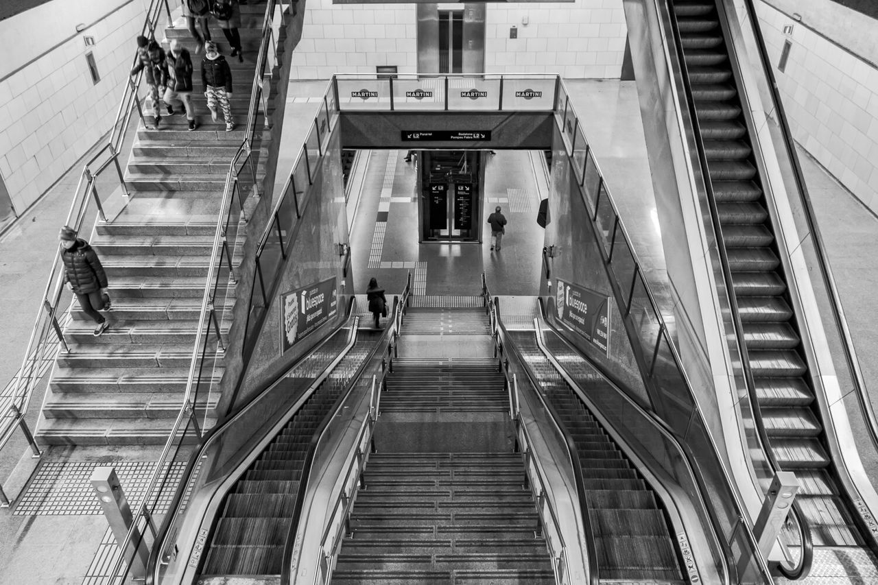 architecture, built structure, steps, building exterior, steps and staircases, staircase, railing, the way forward, high angle view, building, men, walking, low angle view, diminishing perspective, transportation, city, stairs, person, day