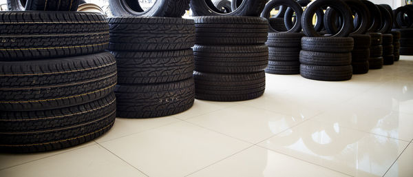 Tires on tiled floor for sale in store