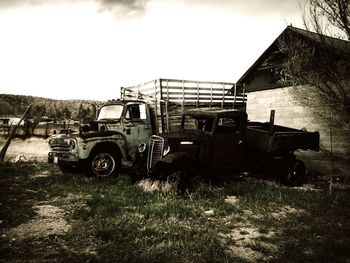 Abandoned car on dirt road