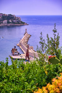 High angle view of castle by sea against sky