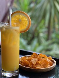 Close-up of orange juice on table
