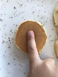 Midsection of person holding cookies