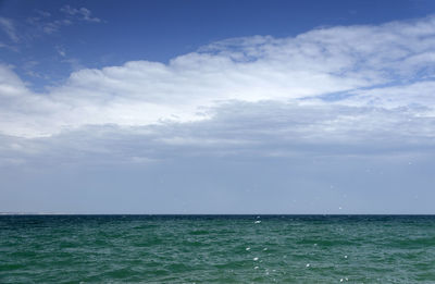 View of calm blue sea against the sky