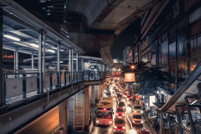 Illuminated cars on street in city