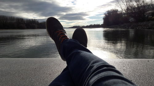 Low section of man legs in lake