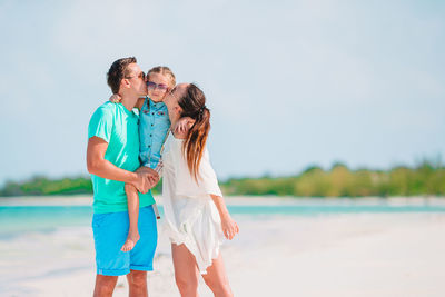 Couple holding hands in water