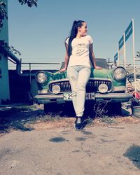 Full length of woman standing against sky