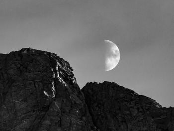 Low angle view of rock formation against sky