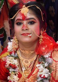 Portrait of young woman in traditional clothing