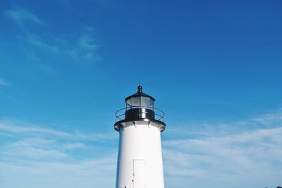 Low angle view of lighthouse against blue sky