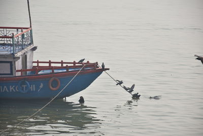 Boats moored in sea