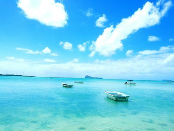 Scenic view of sea against blue sky