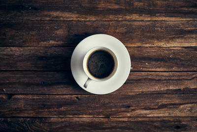 Directly above shot of coffee cup on table