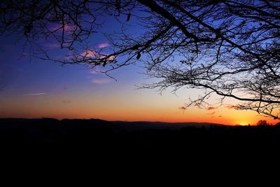 Scenic view of silhouette landscape against clear sky at sunset