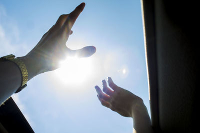 Close-up of hand holding sun