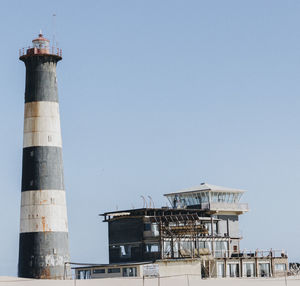 Low angle view of lighthouse against clear sky