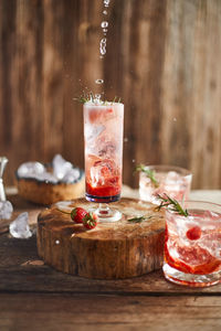 Close-up of drinks on wooden table