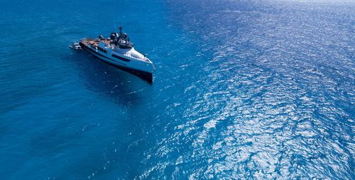 High angle view of boat sailing in sea