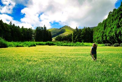 Man on field against sky