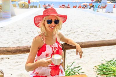 Young woman wearing sunglasses at beach