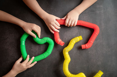 High angle view of woman holding hands on table