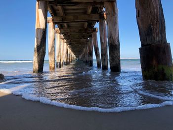 Pier over sea against sky